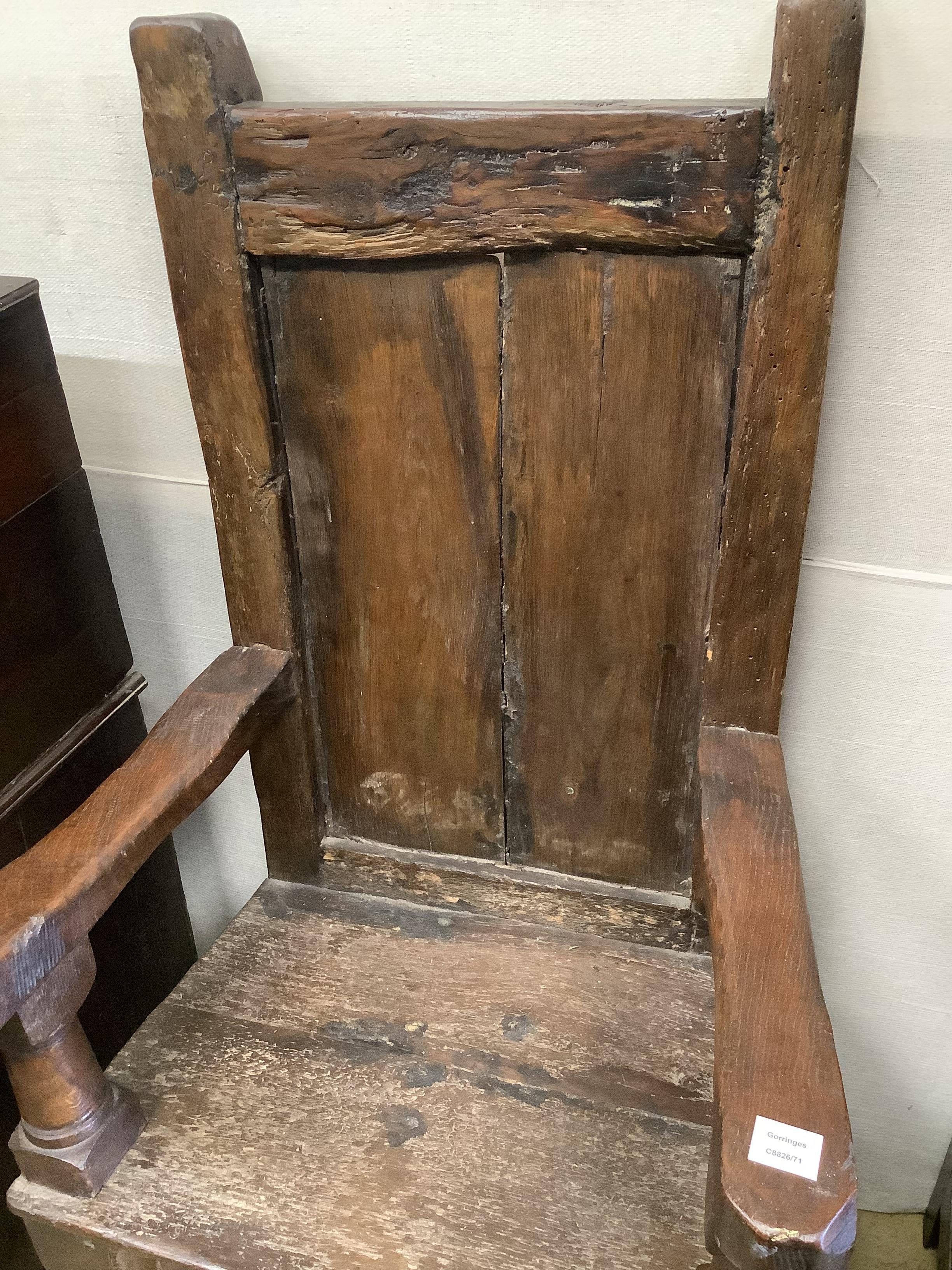 A 17th century oak panelled back armchair